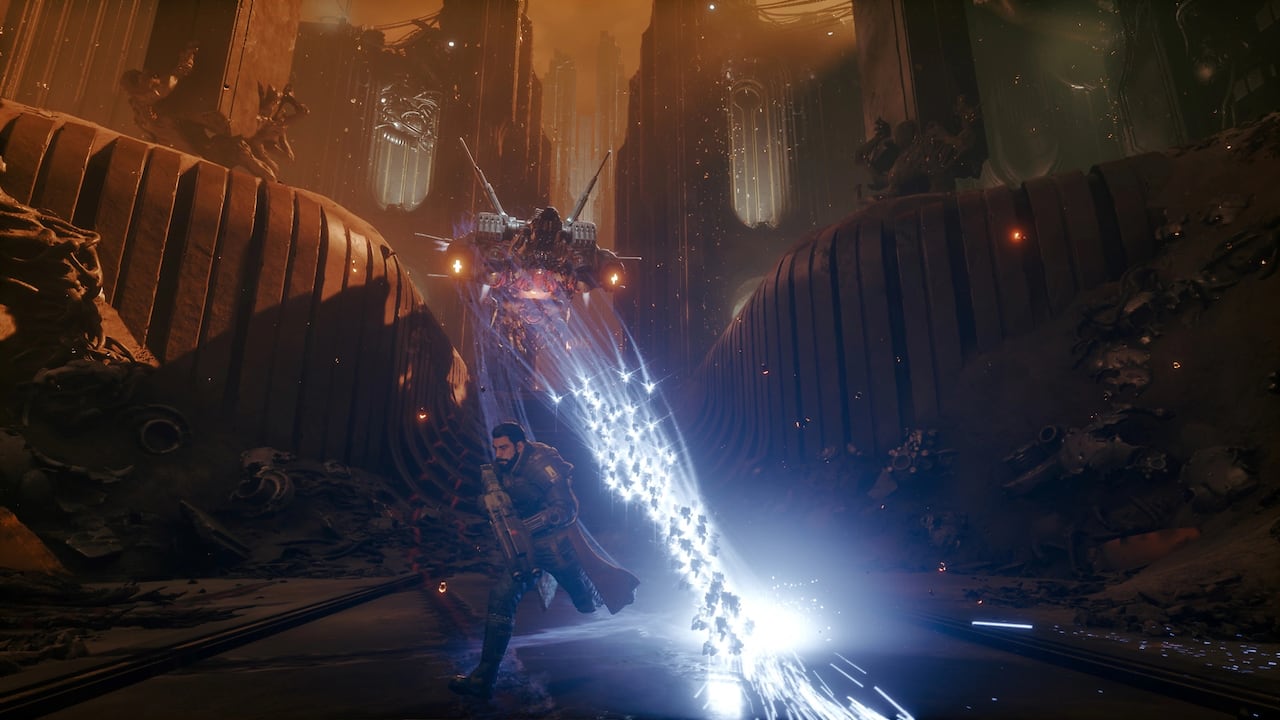 Video game screenshot of a man running from a flying machine enemy shooting bright blue energy bullets at him.