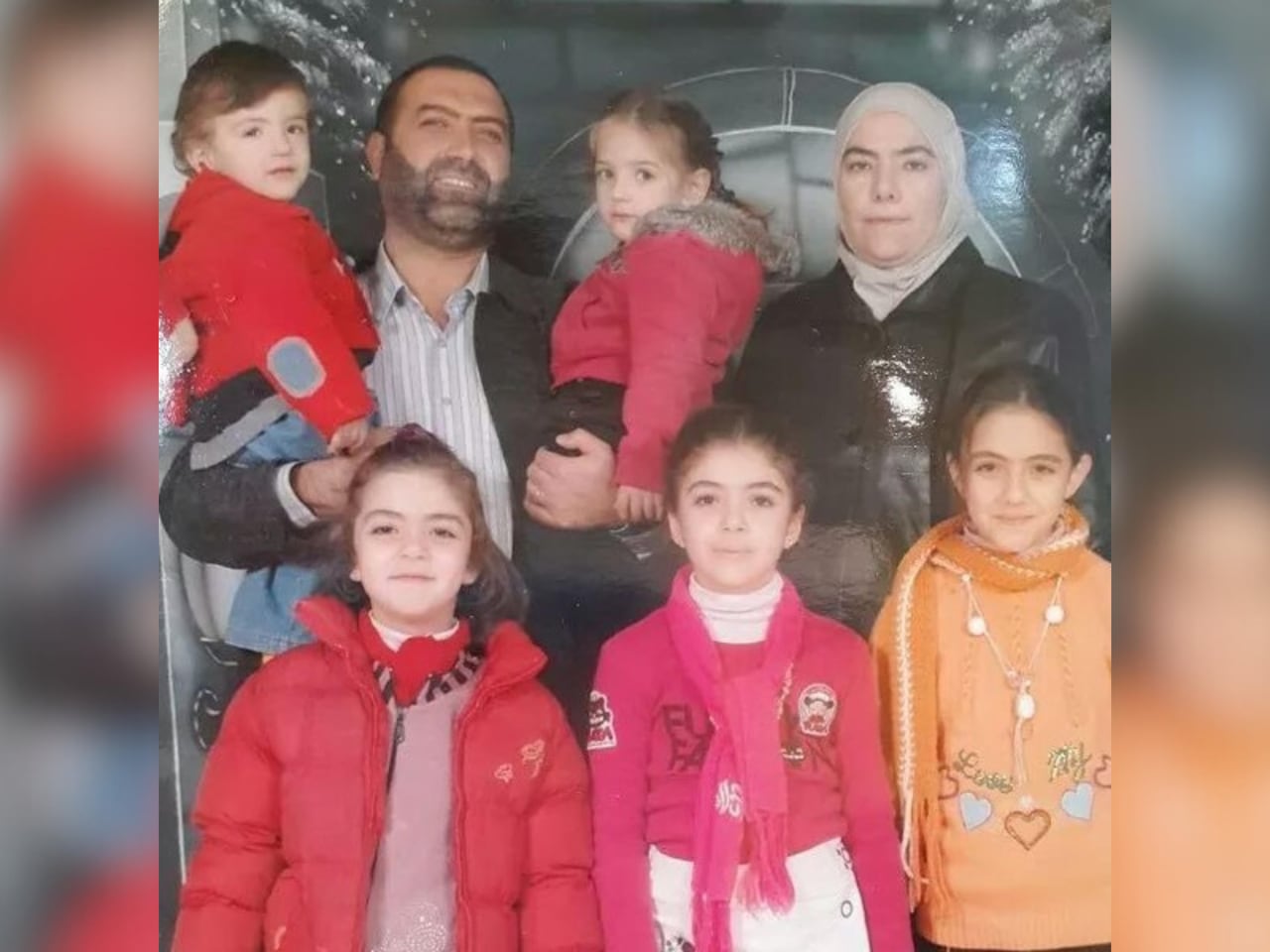 Rania Al-Abbasi with her husband and six children. 