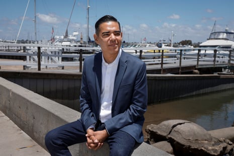 A man in a suit looking into the distance.